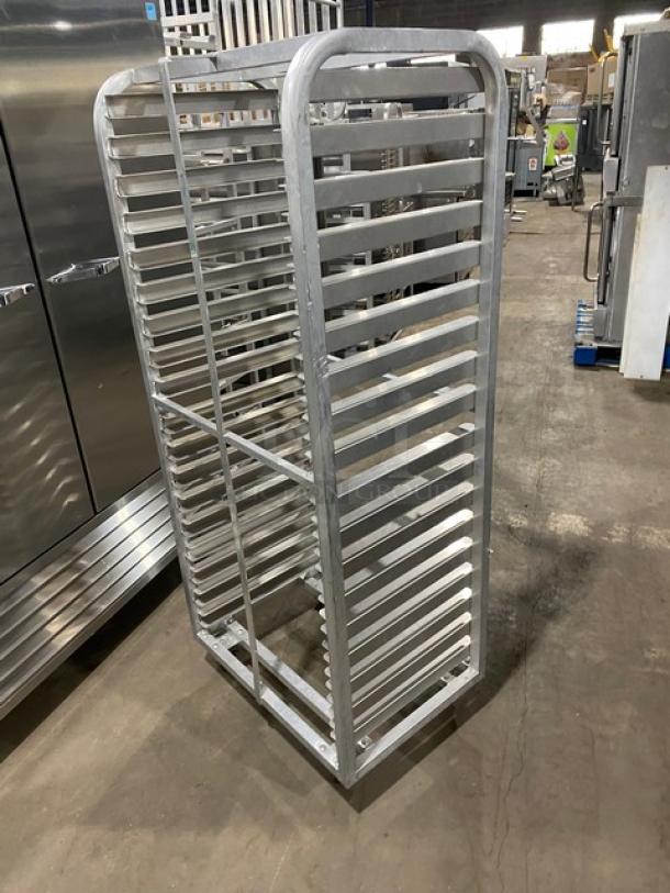 Commercial heavy-duty pan holding/cooling rack on casters. Stainless steel, multiple shelves, excellent condition. Ideal for kitchens.