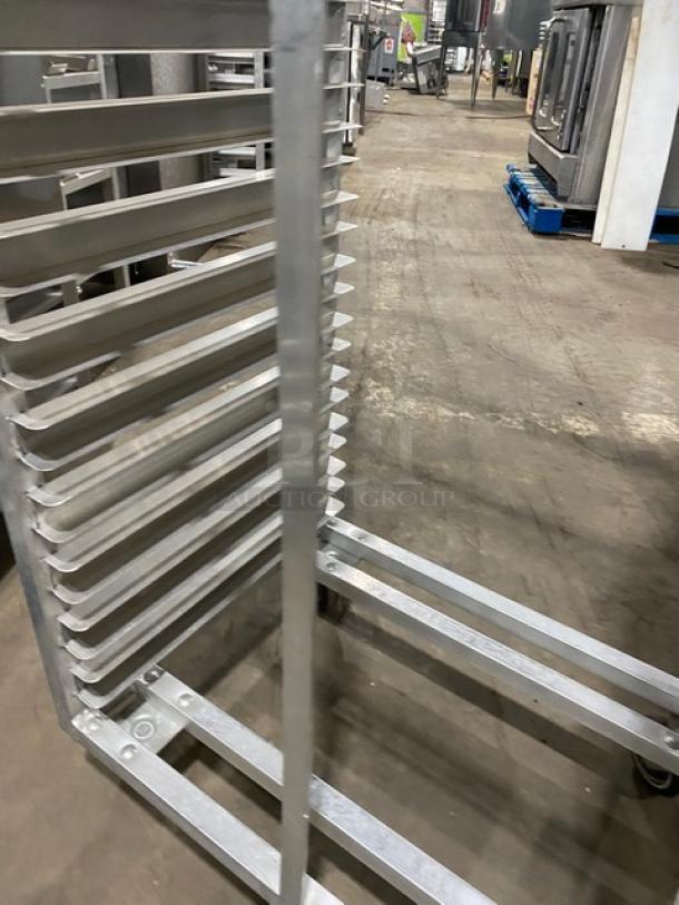 Commercial heavy-duty pan holding rack on casters, metal construction, multiple shelves, industrial use, excellent condition.