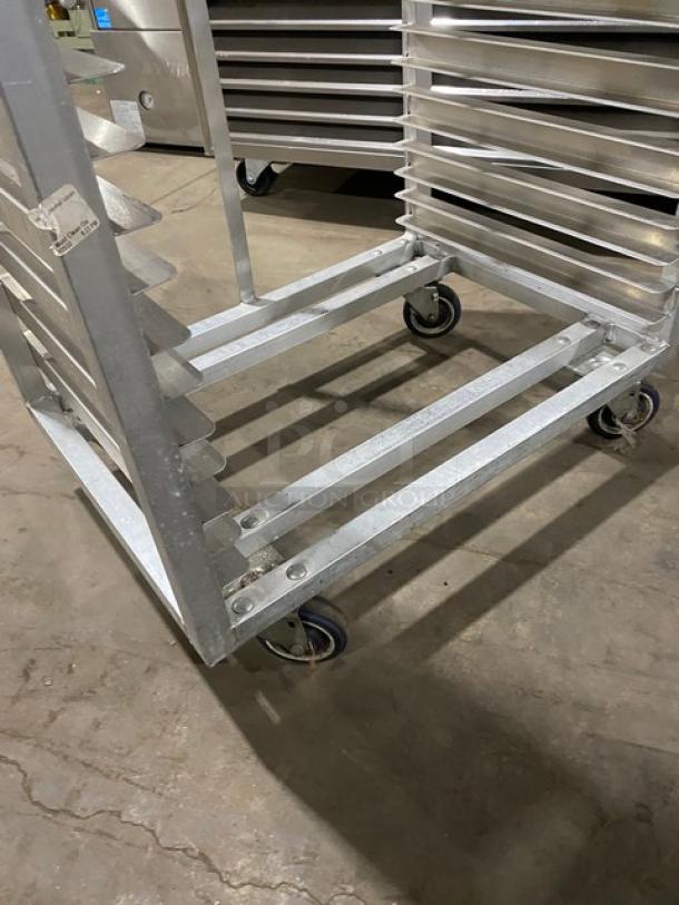 Commercial heavy duty pan rack on casters, metal construction, holds multiple pans, excellent condition, ideal for cooling.
