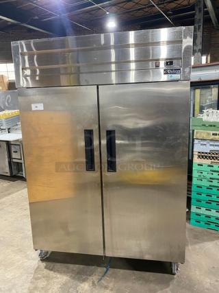 Dukers commercial stainless steel 2-door reach-in freezer, model D55AF, on casters with poly-coated wire racks, 115V.