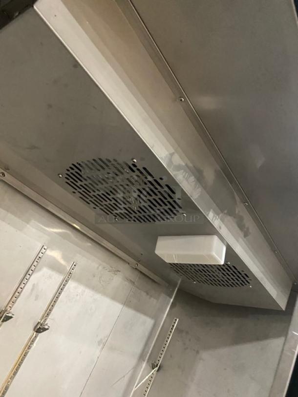 Dukers D55AF commercial 2-door stainless steel freezer interior. Features poly coated wire racks and on casters. 115V.