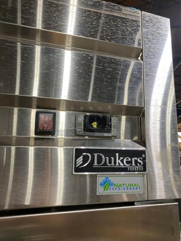 Dukers D55AF commercial stainless steel 2-door reach-in freezer with poly-coated wire racks, shown on casters, 115V, natural refrigerant.