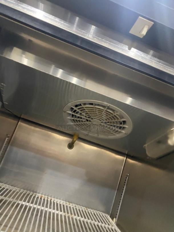 Centaur CSD1DR single door reach-in refrigerator interior with poly-coated wire racks, stainless steel finish, and fan unit.