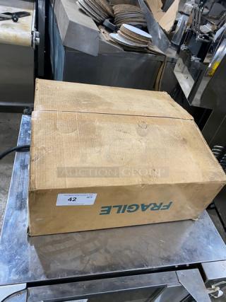New Krampouz stainless steel natural gas crepe maker in box. Box marked "Fragile" with label indicating quantity 42.
