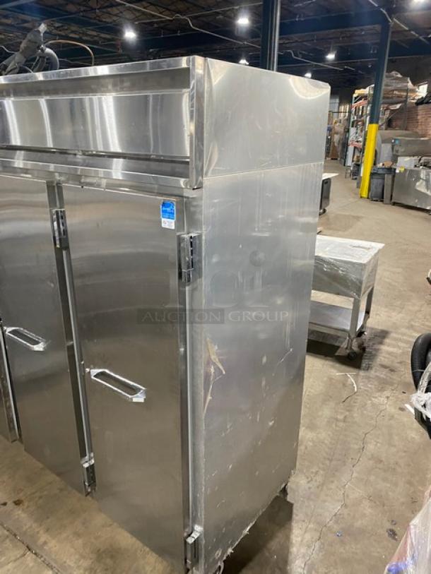 Continental 3F stainless steel 3-door reach-in freezer, poly coated wire rack, built-in pan holding slides, on casters.