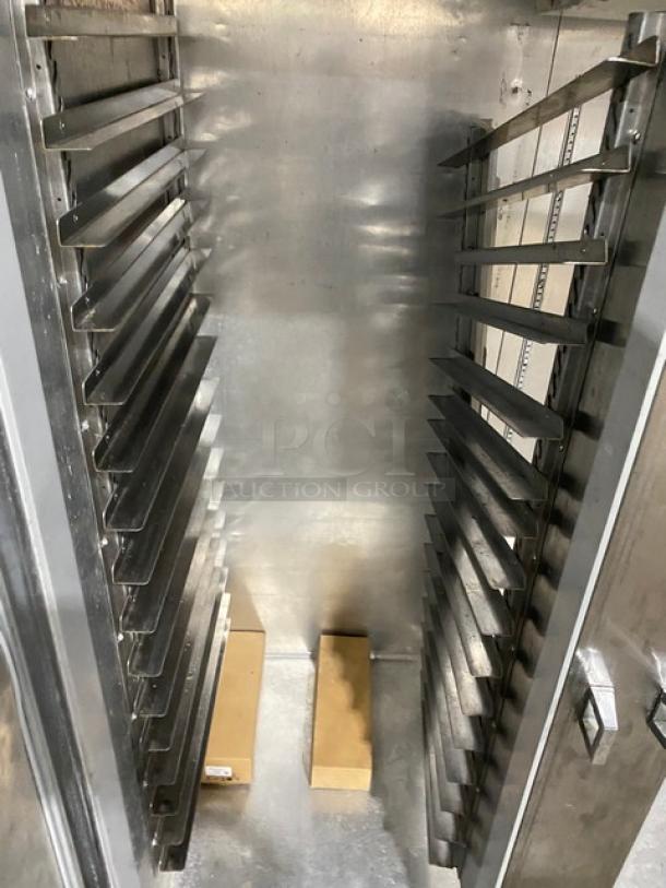 Continental 3F stainless steel 3-door reach-in freezer, poly-coated wire rack, built-in pan slides, serial 15127134, on casters.