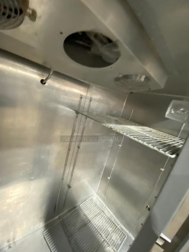 Continental 3F stainless steel freezer interior; poly coated wire rack, built-in pan holding slides, clean condition.