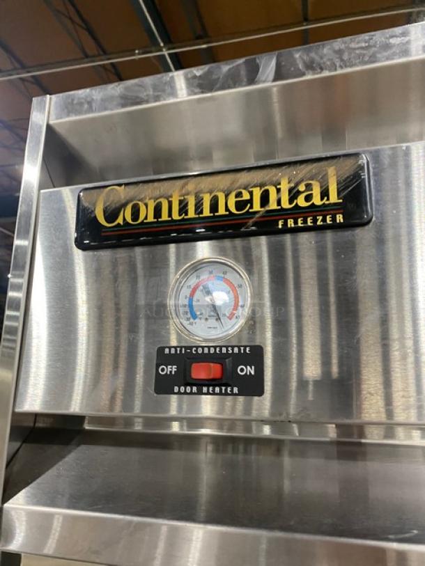 Continental 3F stainless steel reach-in freezer, 3 doors, with poly-coated wire rack, built-in pan slides, on casters.