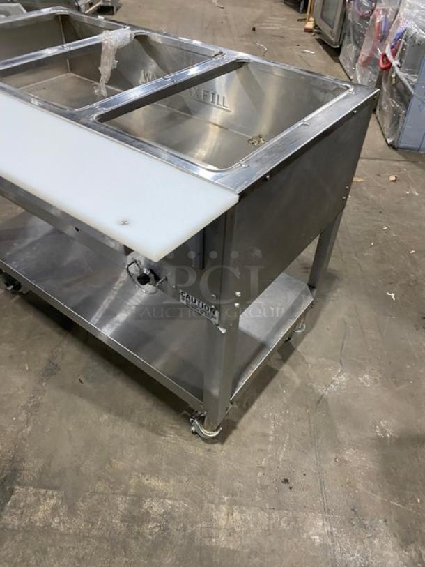 Duke Manufacturing AeroHot Series 3-well hot food/steamtable, stainless steel, model WB303, with undershelf and cutting board.