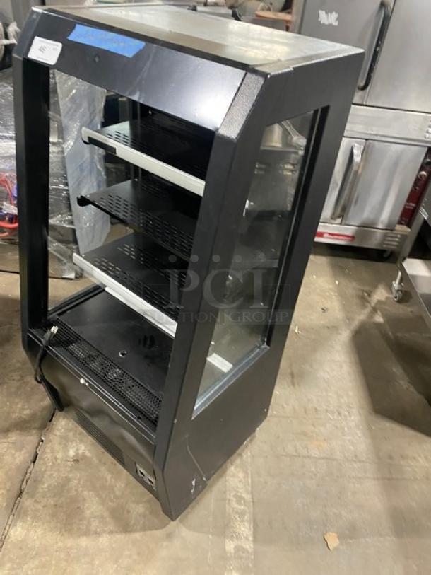 Black multi-tier refrigerated grab-n-go display case, Model 189MAC26HC, with pull-down curtain, on casters, excellent condition.