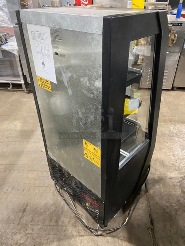 Commercial black multi-tier refrigerated display case model 189MAC26HC, on casters, with pull-down night curtain, minor wear.