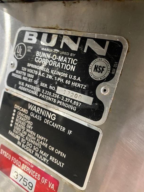 Bunn O-Matic ST-15 coffee brewer label, serial 13200, shows NSF certification, voltage, and safety warnings.