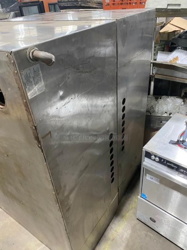 Bakers Pride commercial natural gas double stacked pizza deck oven with legs, stainless steel, durable condition.