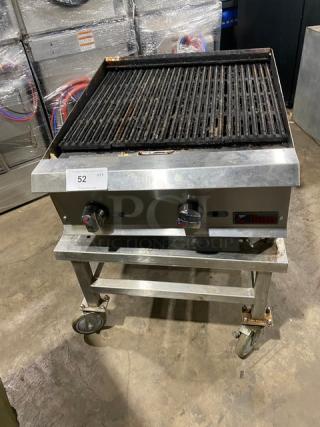 Ikon stainless steel natural gas char broiler with open base equipment stand on casters. Used condition.