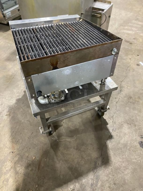 Ikon commercial stainless steel natural gas char broiler on legs with open base equipment stand and casters, used condition.