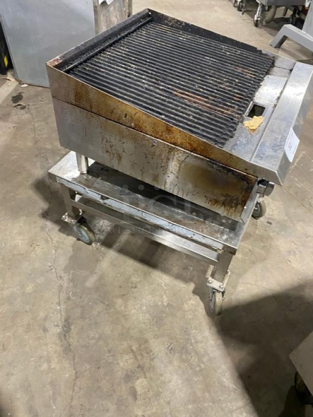 Ikon stainless steel natural gas char broiler on legs, open base stand with casters, used condition.