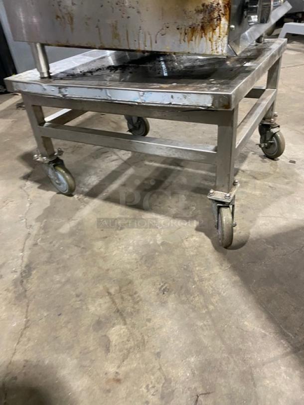 Ikon stainless steel countertop char broiler on legs with open base stand, on casters, natural gas powered, used condition.