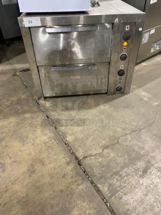 Commercial stainless steel electric countertop pizza/deck oven with thermostatic controls, dual doors, used condition.