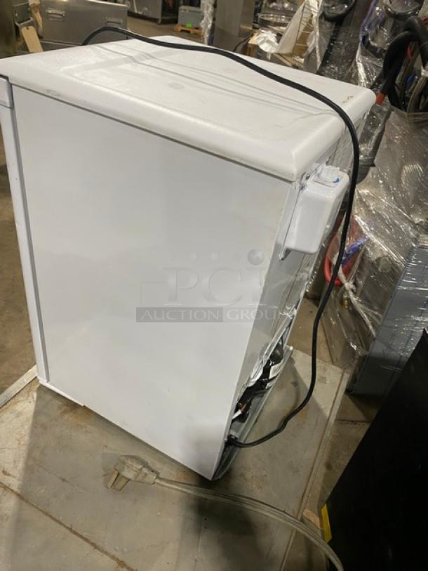 Danby Commercial white single door refrigerator, Model DAR026A1WDD, Energy Star, with poly coated wire racks, on legs.
