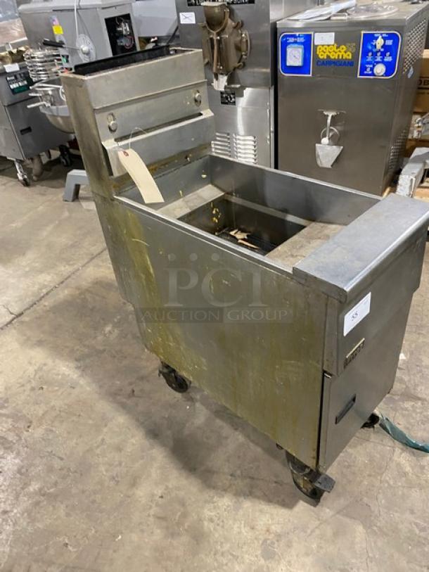 Pitco commercial stainless steel natural gas deep fat fryer with back splash, basket hanger, on casters; used condition.