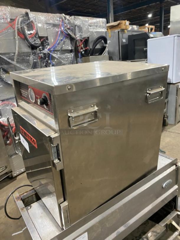 Wittco stainless steel heated holding system, Model 1220-3. Features control panel, handles, and sturdy construction.
