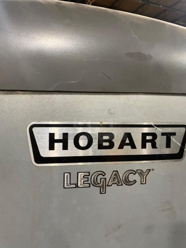 Hobart Legacy Series model HL662 commercial mixer, featuring stainless steel bowl guard and mixing bowl, with spiral dough hook attachment.