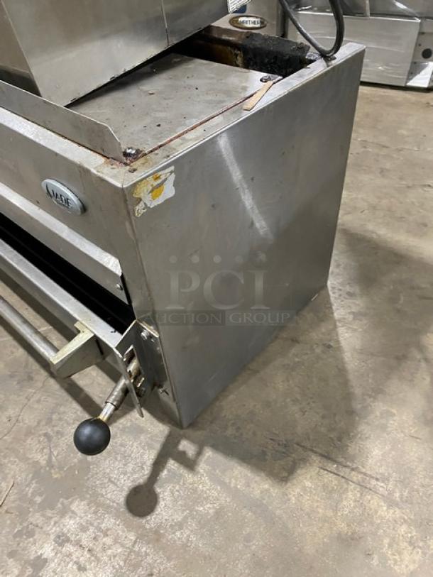 Jade Range stainless steel overhead salamander broiler, natural gas, commercial use, visible wear, brand label on side.