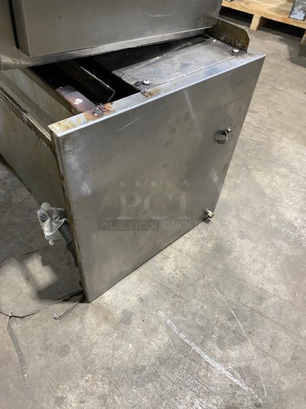 Jade Range stainless steel overhead salamander broiler, natural gas powered, showing signs of wear.