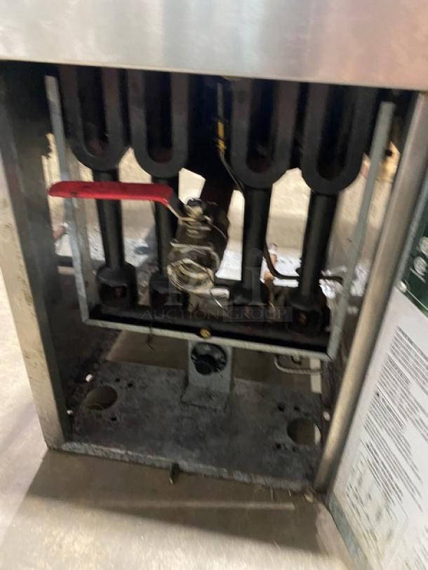 Connerton 2022 stainless steel liquid propane deep fat fryer, model CSG-F4-LP, with backsplash and basket hangers.