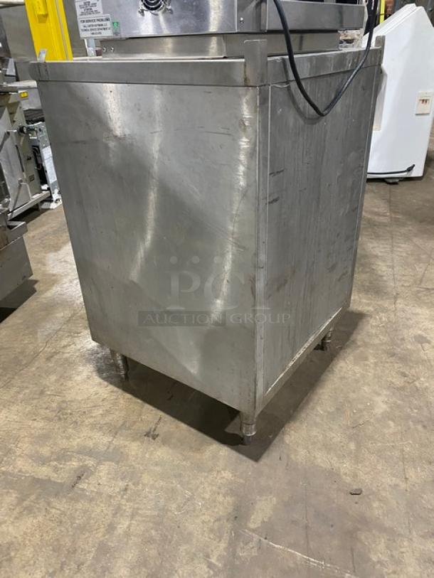 Commercial stainless steel dry storage unit with two drawers on legs. Features durable build, ideal for kitchens. Good condition.