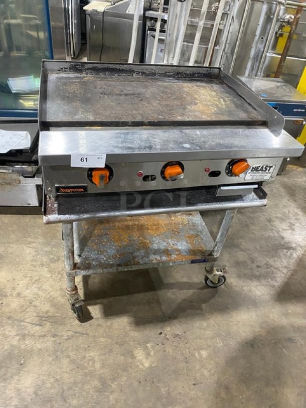 Sierra 2017 stainless steel natural gas flat griddle with thermostatic controls on undershelf stand with casters. Used condition.