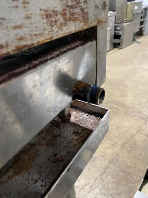 Sierra 2017 stainless steel gas griddle, thermostatic controls, undershelf stand, casters, visible wear and rust.