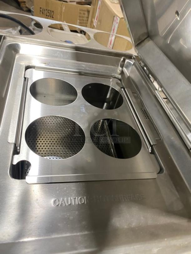 Waring Commercial WPC100 stainless steel pasta cooker, electric, countertop model, perforated inserts, caution mark visible.