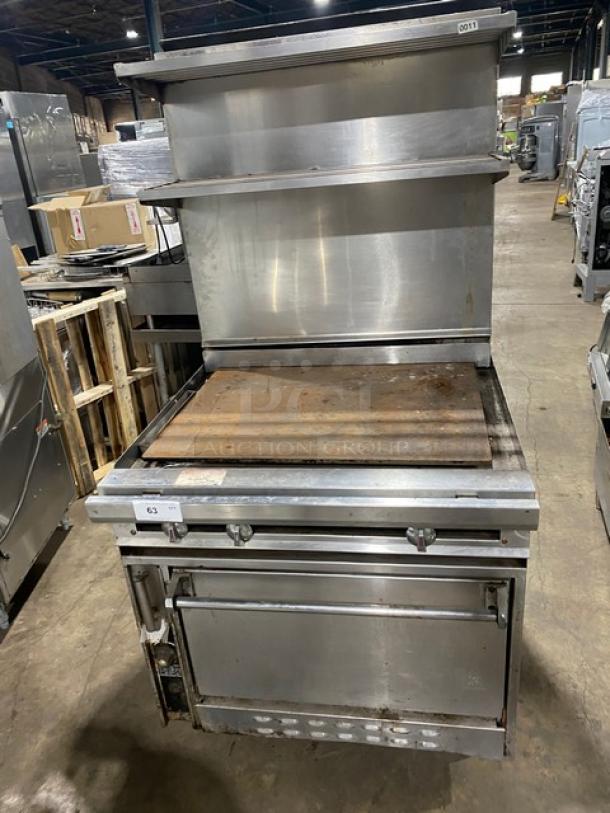 Jade Range commercial stainless steel flat top range/oven combo with backsplash, double overhead shelf, and wired oven rack.