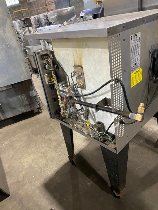 Southbend SLGS12SC commercial stainless steel natural gas convection oven, single stack, with wired rack, on legs.
