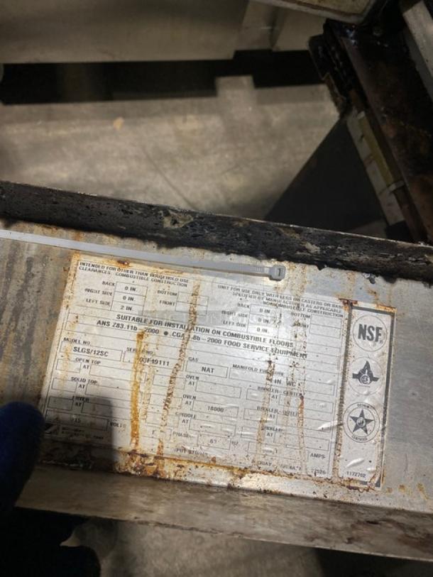 Southbend Model SLGS12SC stainless steel natural gas convection oven with wired rack, worn label, on legs, serial 03F49111.