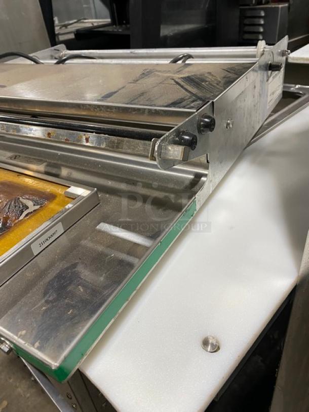 Heat Seal 700ESD stainless steel tabletop wrapper machine, electric powered, 120V, visible model tag, in used condition.