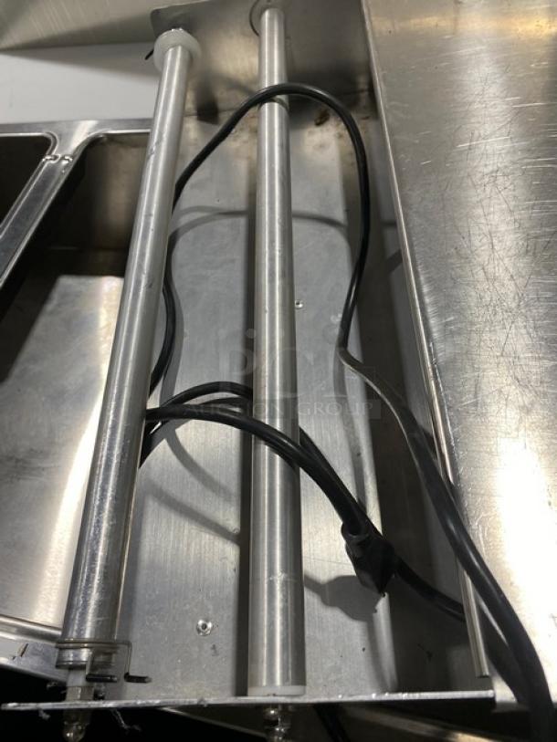 Heat Seal 700ESD stainless steel tabletop wrapper machine, electric-powered, model 700ESD, serial number 2110O0097, 120V, cords visible.