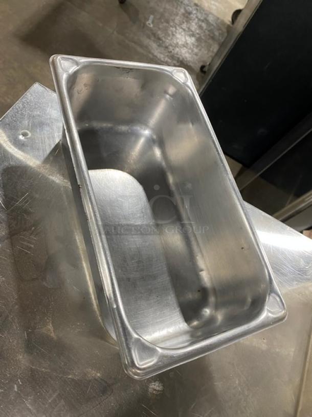 Commercial stainless steel steamtable pan, rectangular shape, smooth finish, slightly used condition.