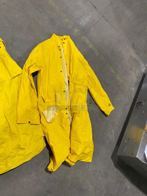 Palmer Safety RS160 Yellow PVC 2X Raincoat, commercial-grade, button closure, new condition, size 2X, logo on sleeve.