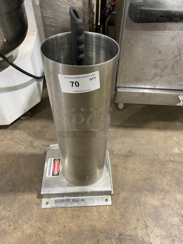Commercial stainless steel manual mincer with black grip handle, on base. Used condition with auction label.