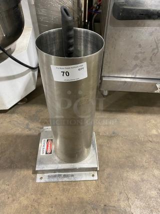 Commercial stainless steel manual mincer with black grip handle, on base. Used condition with auction label.