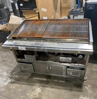 Jade Range commercial stainless steel gas/charcoal smoker grill, features pan slide, enclosed storage, casters; worn grates.