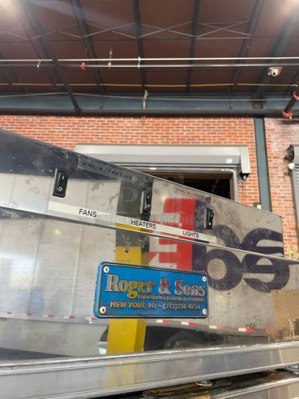Marc Refrigeration commercial freezer, model GDL-5, stainless steel with 5 glass doors, poly-coated wire racks, tags visible.