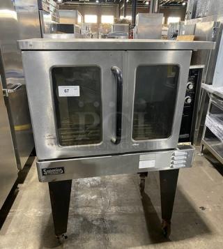 Southbend commercial stainless steel convection oven, model SLGS12SC, in good condition with wired oven rack, on legs.