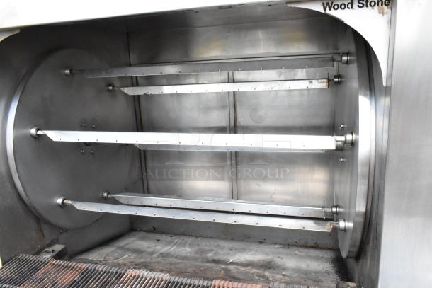 Wood Stone WS-SFR-6-SB stainless steel commercial rotisserie with 6 spits and charbroiler grill, on commercial casters.
