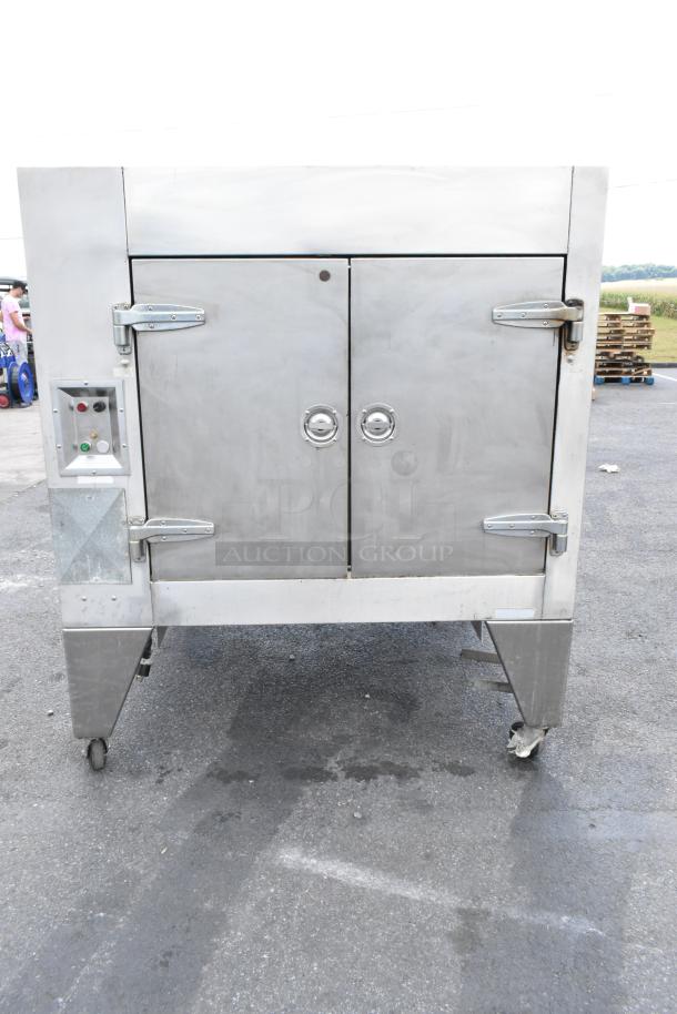 Wood Stone WS-SFR-6-SB stainless steel wood-fired rotisserie with 6 spits, charbroiler grill, and commercial casters.