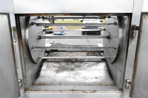Wood Stone WS-SFR-6-SB stainless steel wood-fired rotisserie with 6 spits and charbroiler grill in used condition.