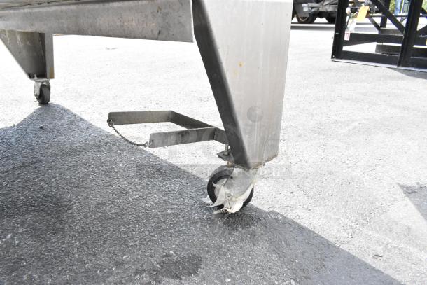 Stainless steel leg and caster of Wood Stone WS-SFR-6-SB rotisserie showing wear.