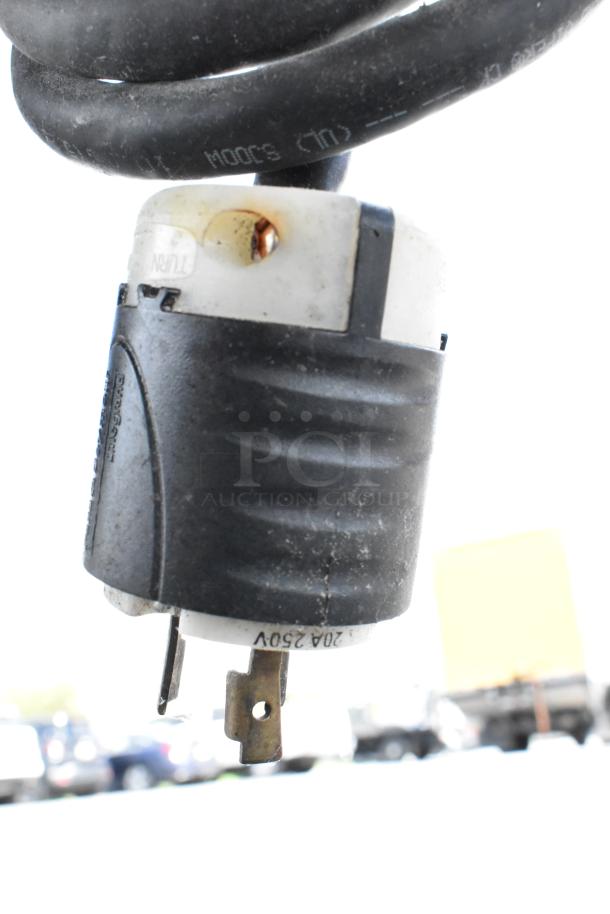 Black and white plug for 240V 250V appliance, with visible wear. Part of a Wood Stone WS-SFR-6-SB rotisserie grill.